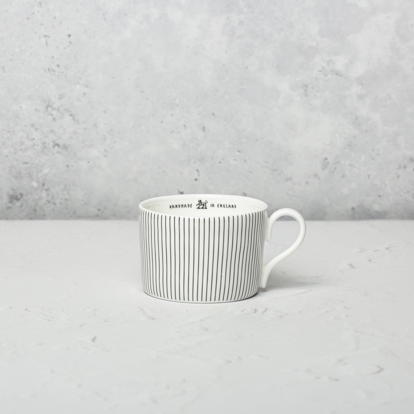 Bone china medium cup by Emma Alington.