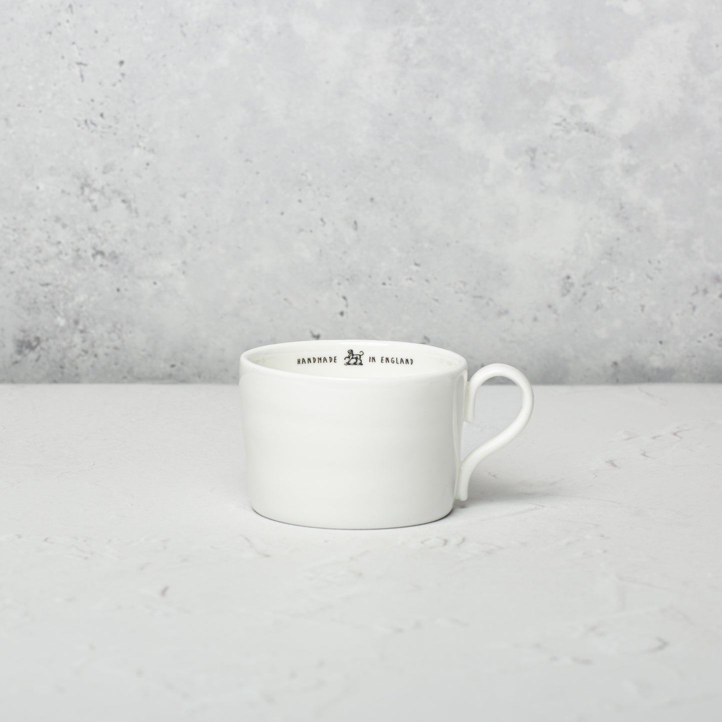 Bone china medium cup by Emma Alington.