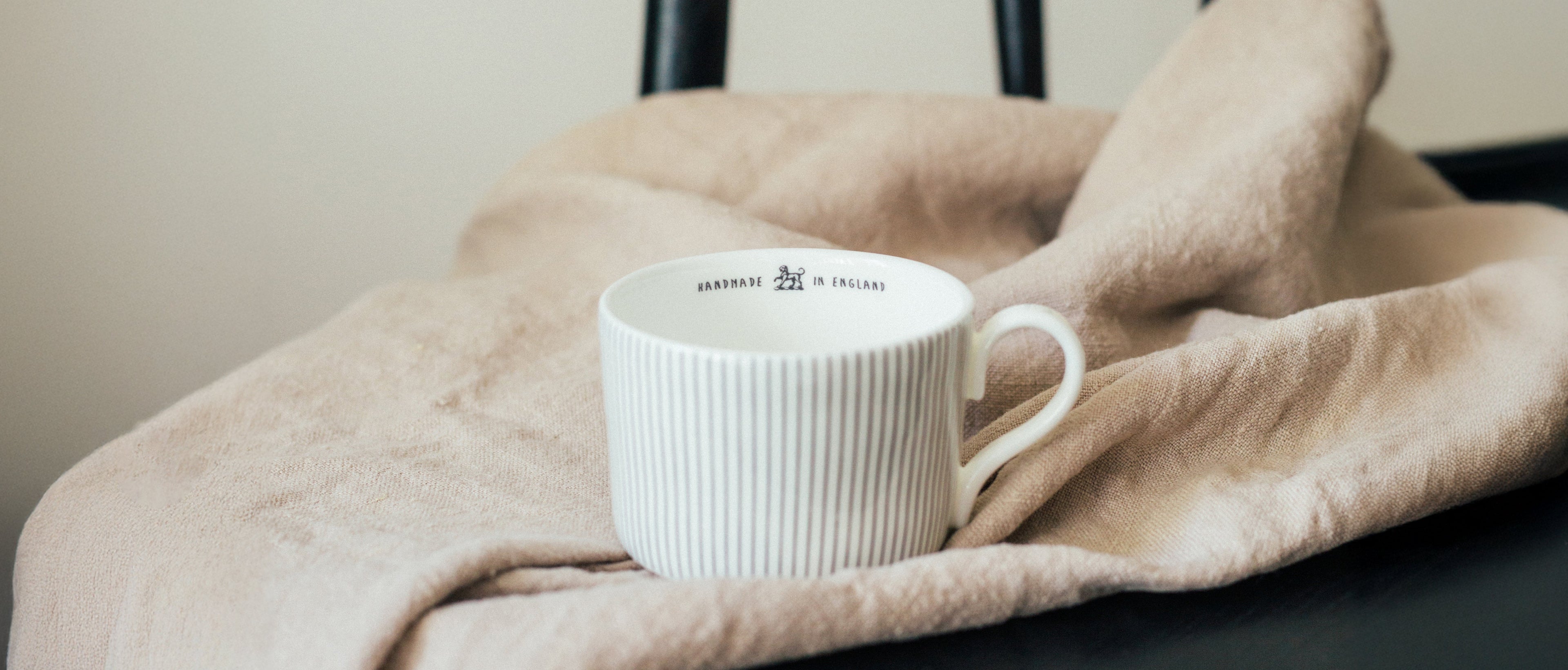 Handmade ceramic coffee cup by UK ceramic designer Emma Alington
