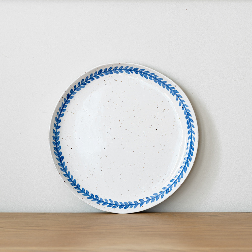 Handmade stoneware salad plate crafted in Berkshire from smooth speckled clay and finished with a hand-painted cobalt blue rim. Timeless, versatile ceramics for everyday use.