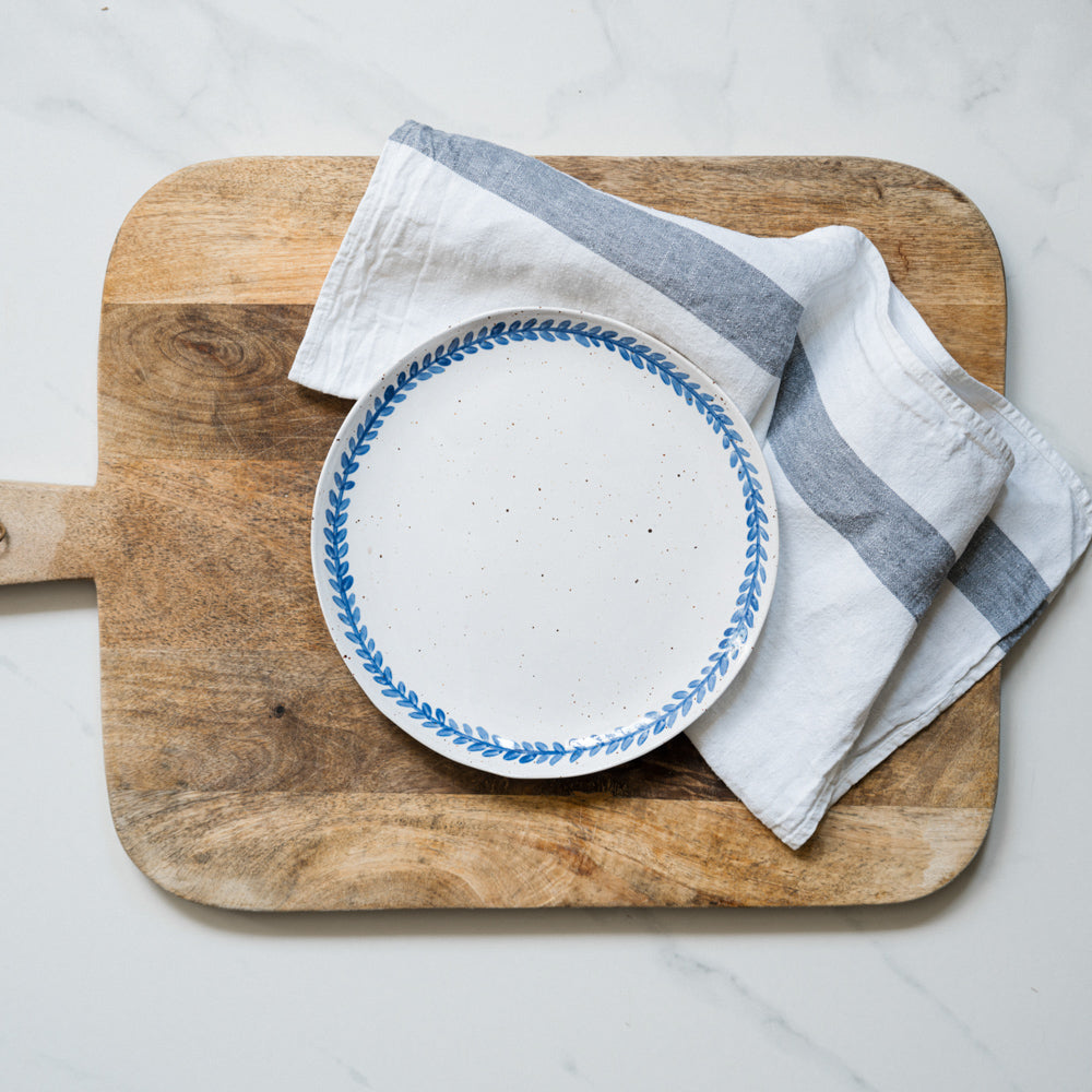 Handmade stoneware salad plate crafted in Berkshire from smooth speckled clay and finished with a hand-painted cobalt blue rim. Timeless, versatile ceramics for everyday use.