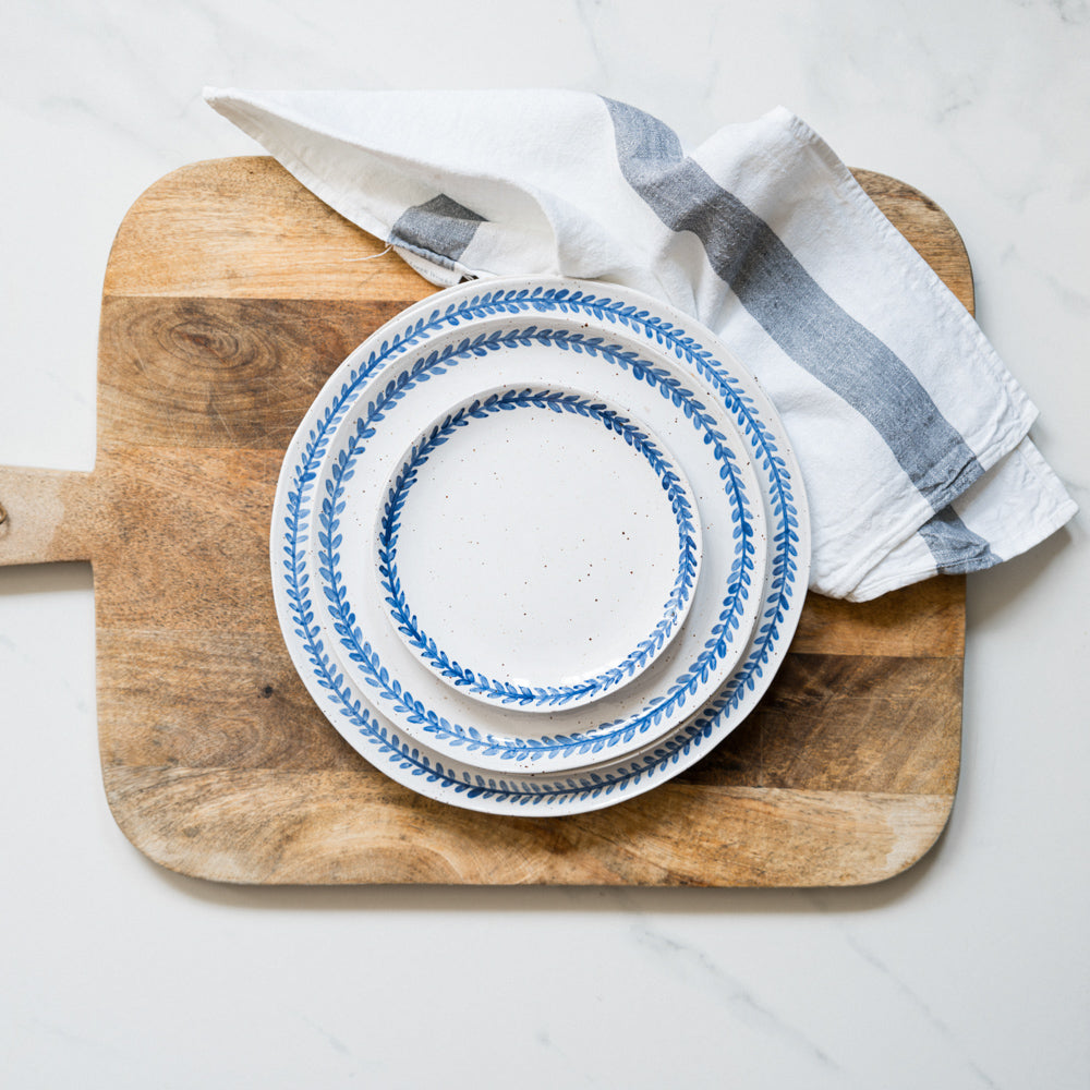 Handmade stoneware salad plate crafted in Berkshire from smooth speckled clay and finished with a hand-painted cobalt blue rim. Timeless, versatile ceramics for everyday use.