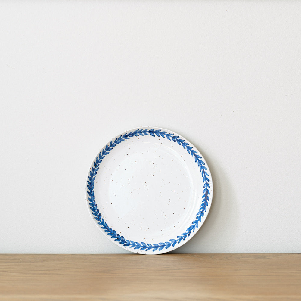 Handmade stoneware small plate crafted in Berkshire from smooth speckled clay and finished with a hand-painted cobalt blue rim. Timeless, versatile ceramics for everyday use.