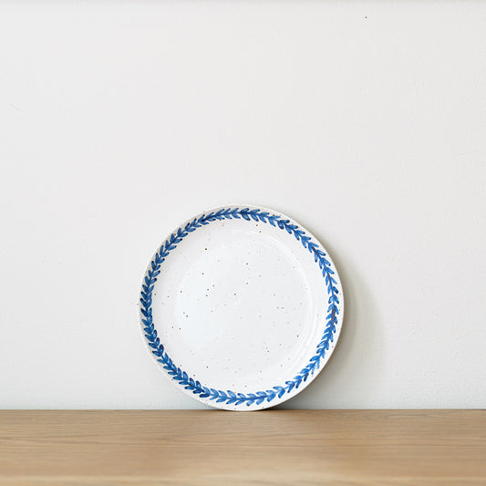Handmade stoneware small plate crafted in Berkshire from smooth speckled clay and finished with a hand-painted cobalt blue rim. Timeless, versatile ceramics for everyday use.
