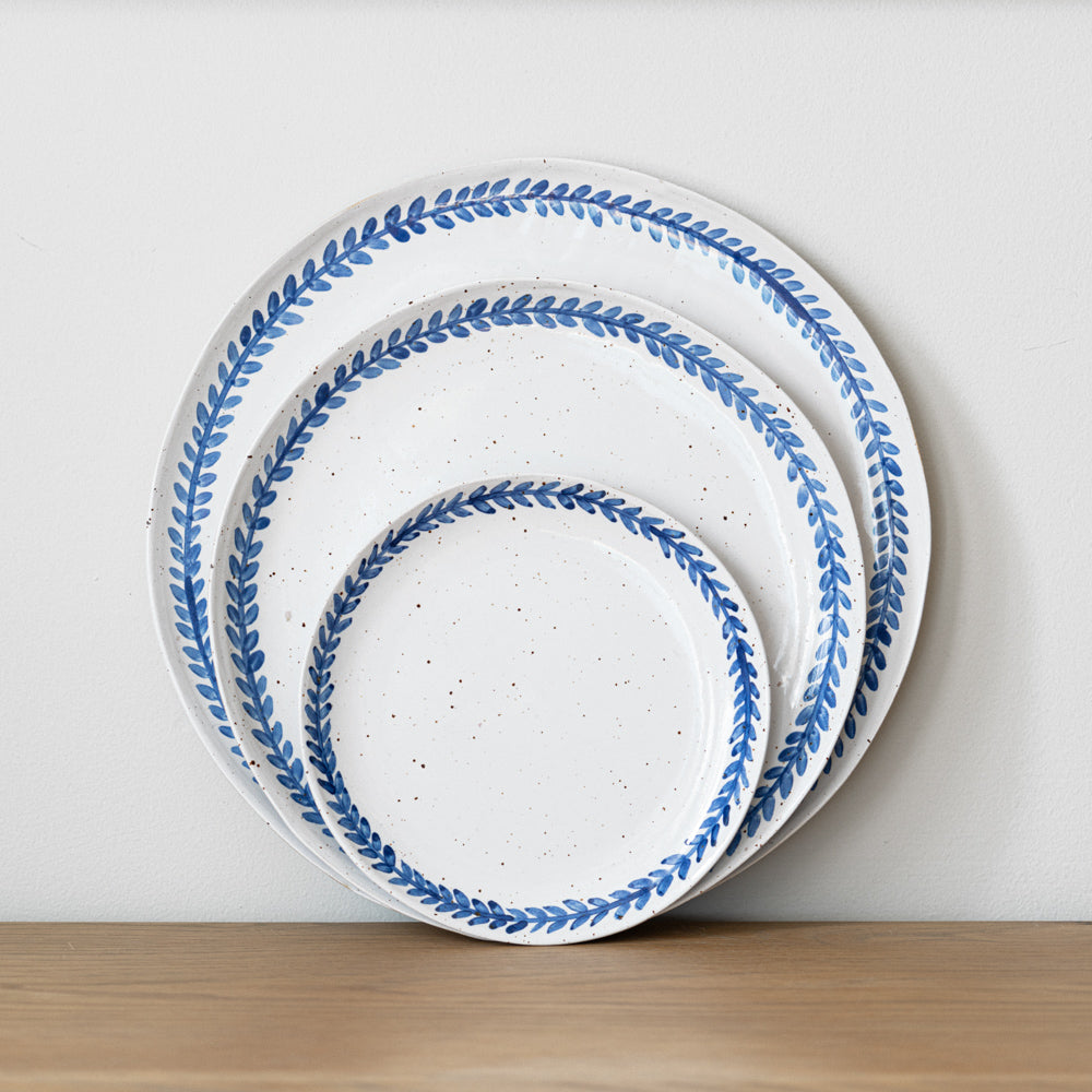 Handmade stoneware small plate crafted in Berkshire from smooth speckled clay and finished with a hand-painted cobalt blue rim. Timeless, versatile ceramics for everyday use.