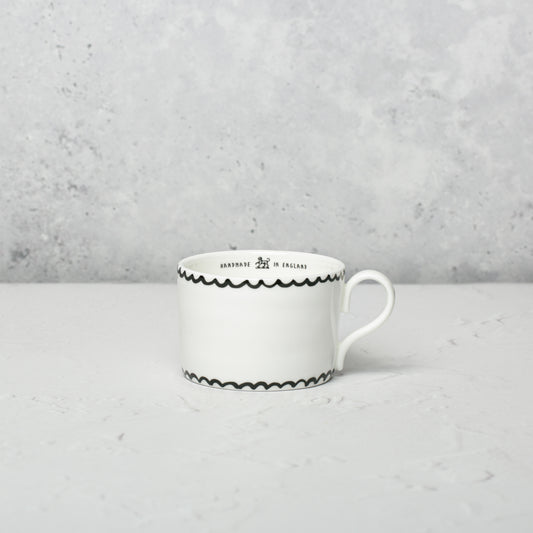 Bone china medium cup by Emma Alington.