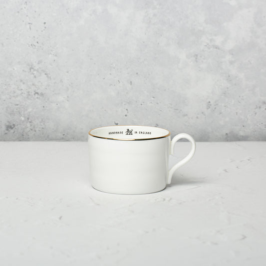 Bone china medium cup by Emma Alington.