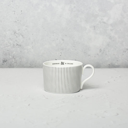 Bone china medium cup by Emma Alington.