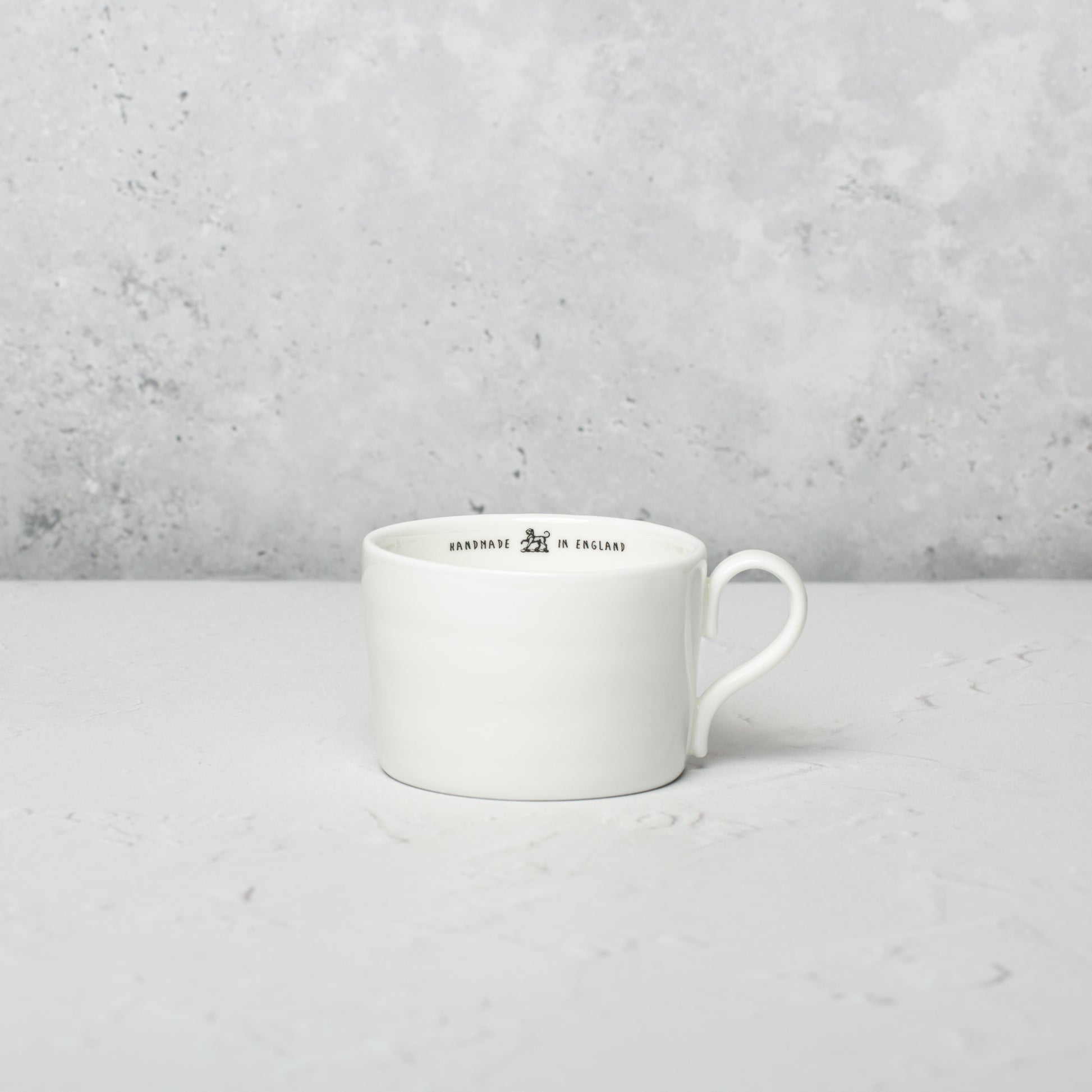 Bone china medium cup by Emma Alington.