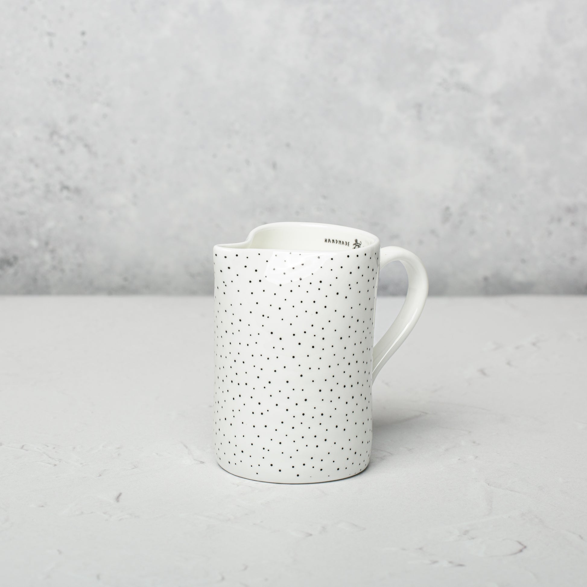 Bone china milk jug by Emma Alington.