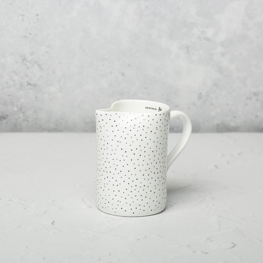 Bone china milk jug by Emma Alington.