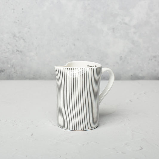 Bone china milk jug by Emma Alington.