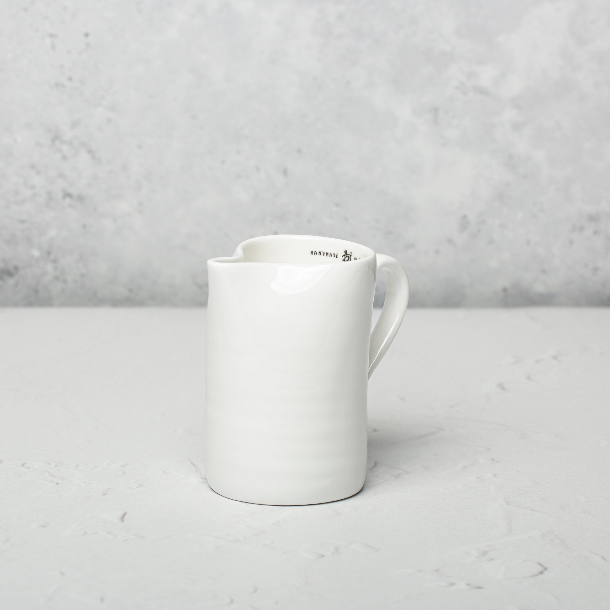 Bone china milk jug by Emma Alington.