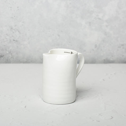 Bone china milk jug by Emma Alington.