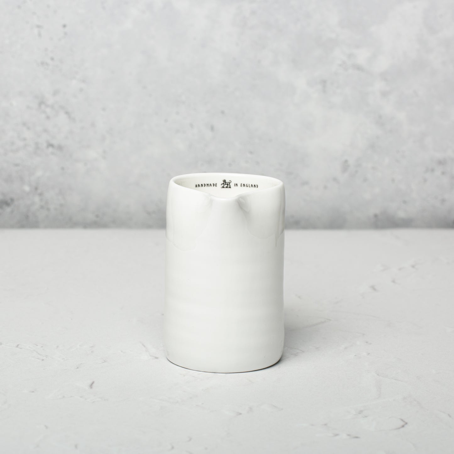 Bone china milk jug by Emma Alington.