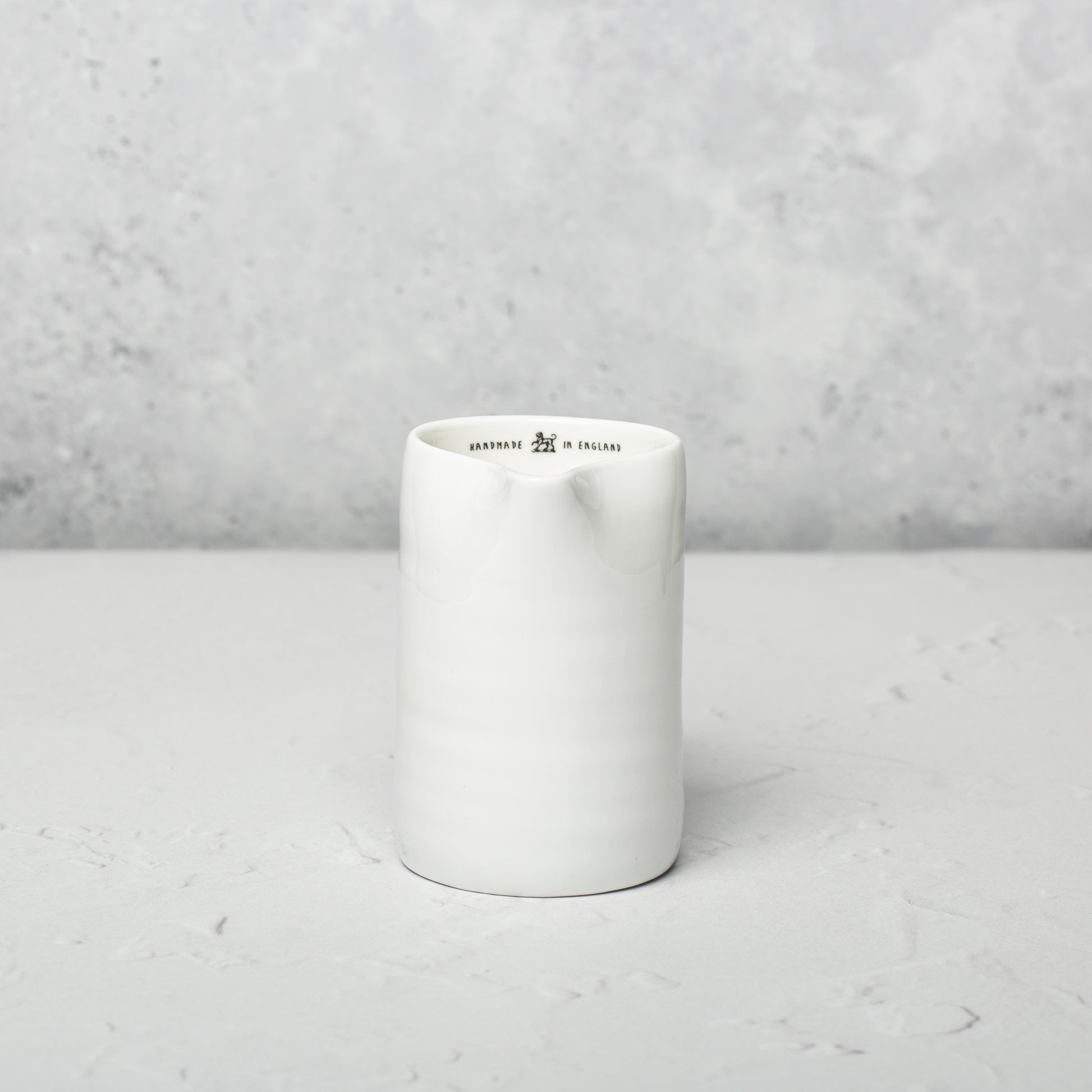 Bone china milk jug by Emma Alington.