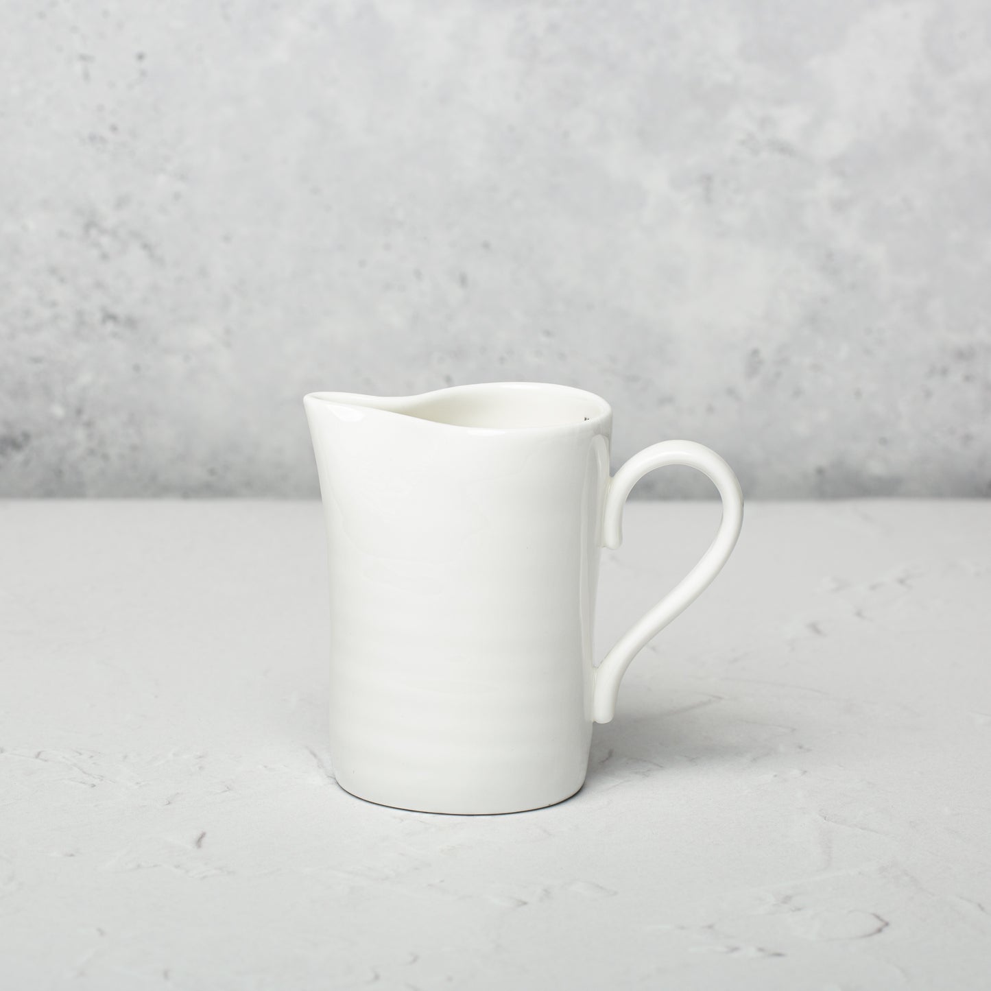 Bone china milk jug by Emma Alington.