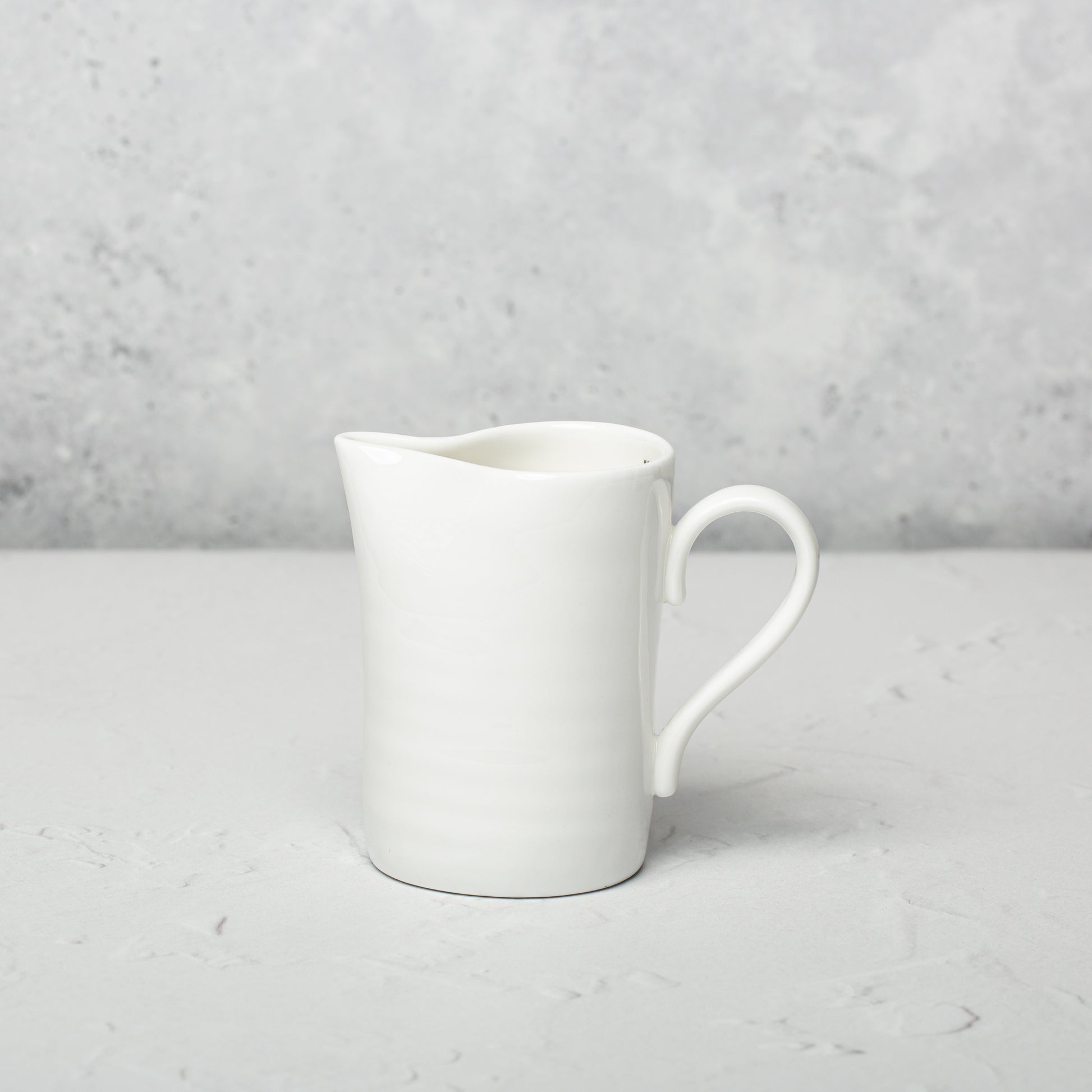 Bone china milk jug by Emma Alington.