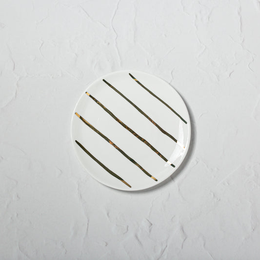Small bone china plate by Emma Alington with hand-painted 22k gold stripes.