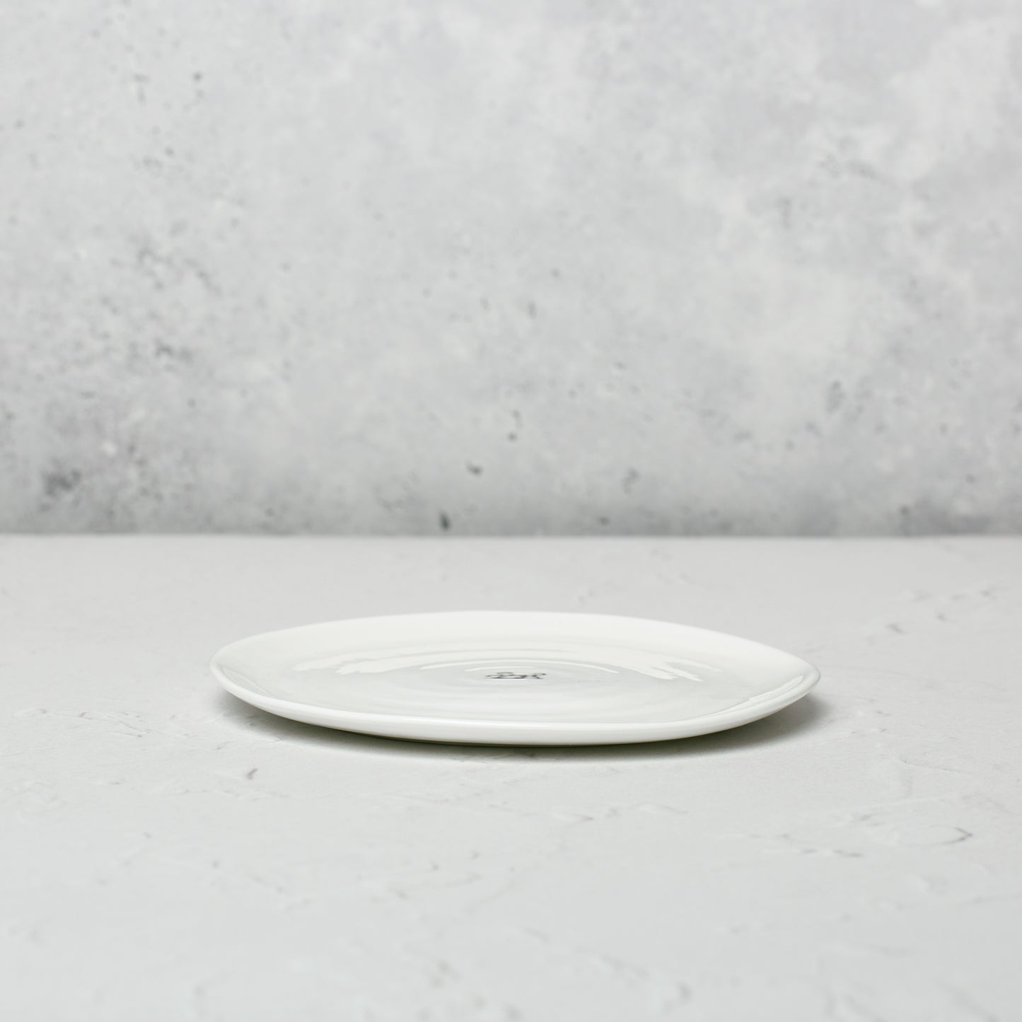 Small classic white bone china plate by Emma Alington.