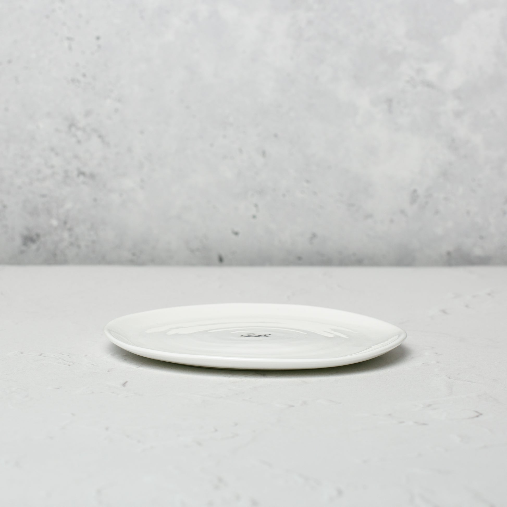 Small classic white bone china plate by Emma Alington.